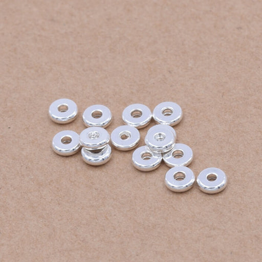 Achat Perles heishi séparateur en acier inoxydable argenté 4x1.2mm - Trou: 1.2mm (10)