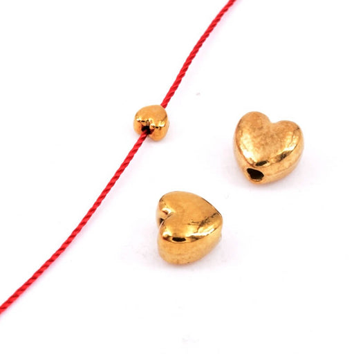 Achat Perle coeur acier inoxydable doré  4mm - Trou: 0.8mm (2)