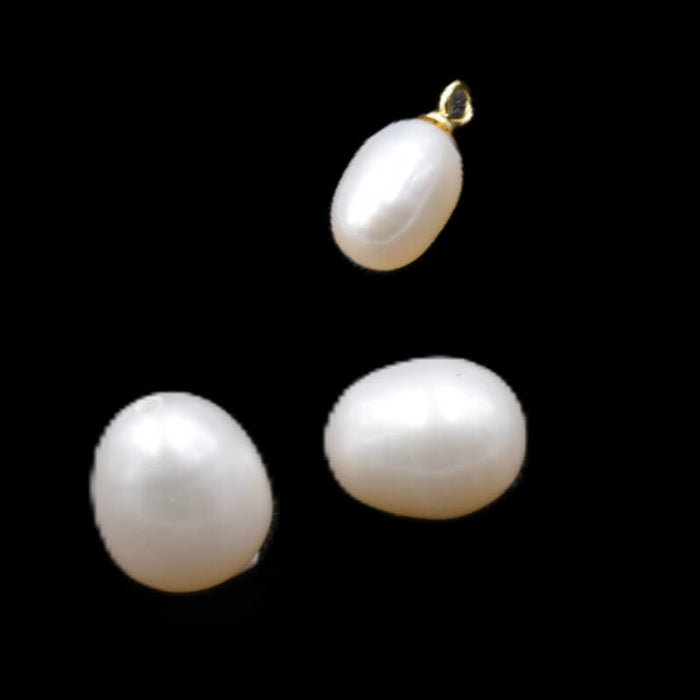 Perles d'eau douce ovales blanc semi percées 9x7mm - Trou: 0.9mm (2)
