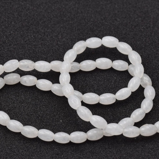 Perle ovale grain de riz jade blanc 6x4mm - Trou: 0.8mm (1fil-39cm)