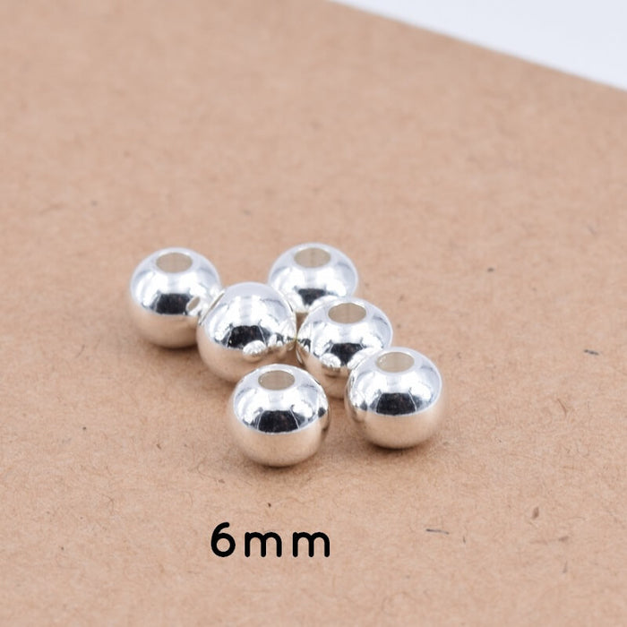 Perles Rondes en Acier Inoxydable Argenté - 6x5mm - Trou : 2mm (10)