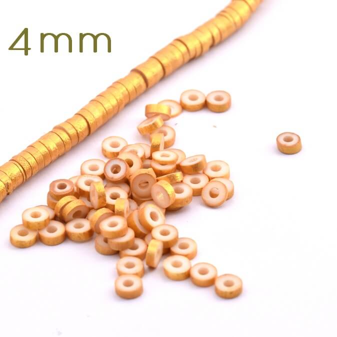 Perle heishi 4x1-1.5mm en pâte polymère doré (1.5g)