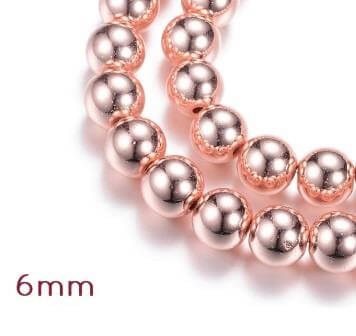 Perles d'hématite reconstituée doré or rose qualité 6mm - 1 rang - 64 perles (vendue par 1 rang)